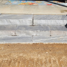 Premium-Retaining-Wall-Construction-Natural-Stone-Entry-Steps 1